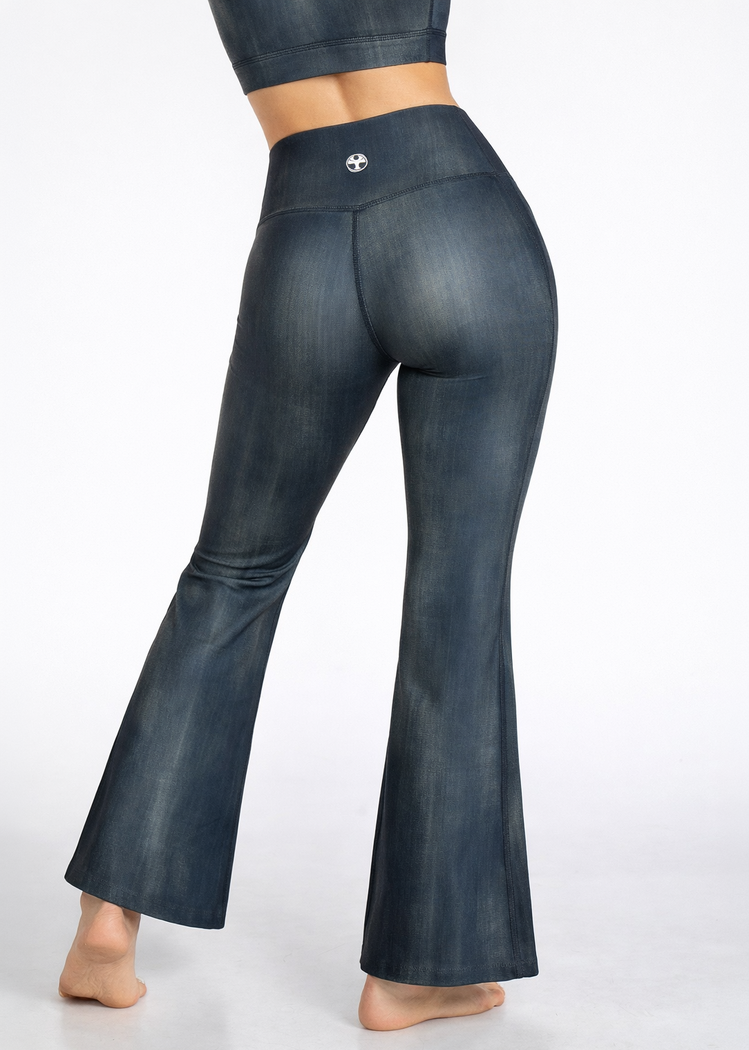 Dark blue flared pants on a white background